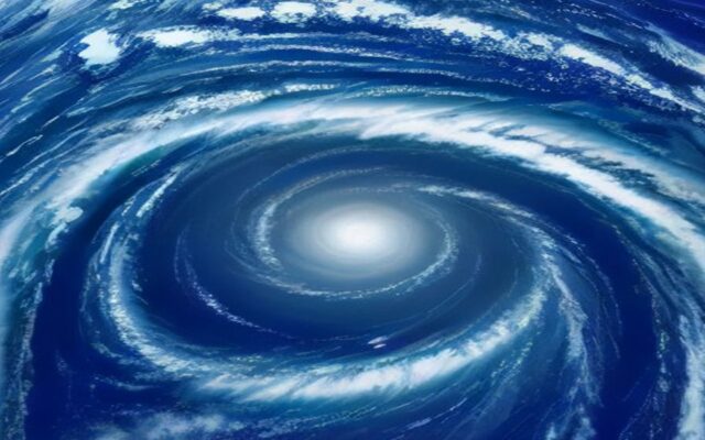 Vista aérea de un ciclón en espiral con bandas de nubes blancas sobre un océano azul intenso